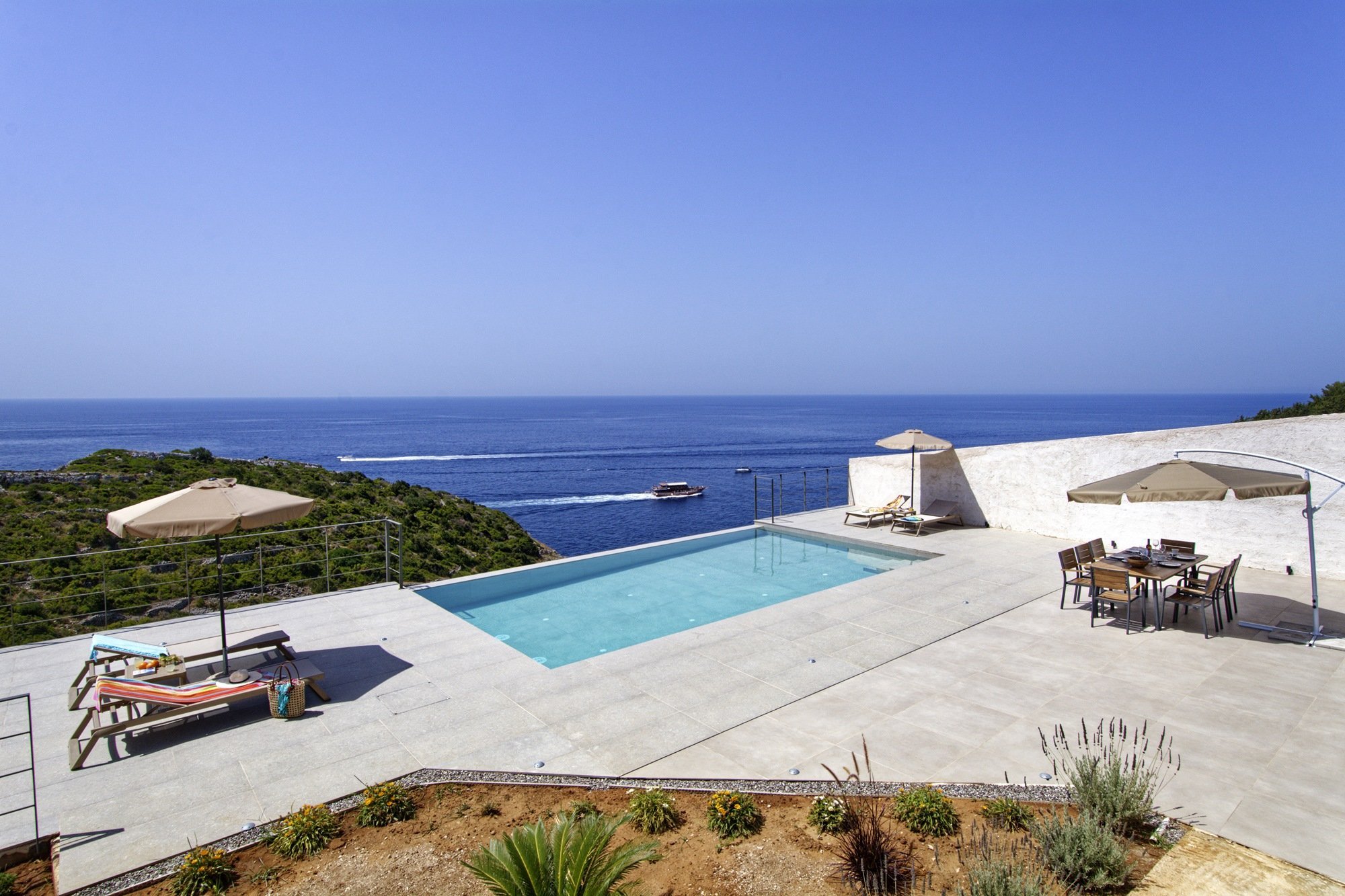 Pool terrace at Dreamcatcher Estate overlooking open sea